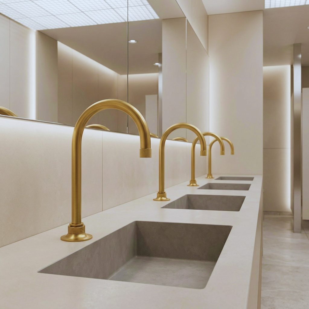 Brushed gold high arc commercial basin faucet used as a fixture schedule and project checklist reference